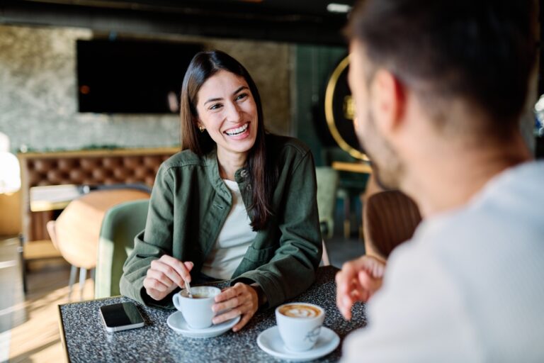 Young,Couple,Enjoying,Conversation,And,Coffee,Together,At,An,Urban
