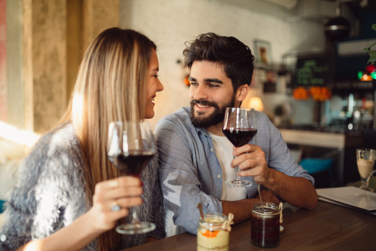 Cheers!,Happy,Smiling,Couple,Drinking,Wine,At,Their,Date,At