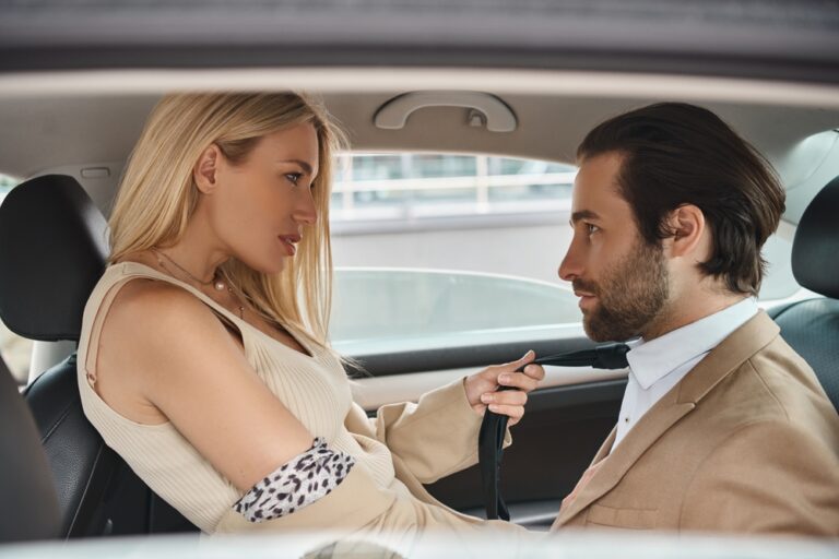 Passionate,Blonde,Businesswoman,Pulling,Tie,Of,Handsome,Colleague,Seducing,Him